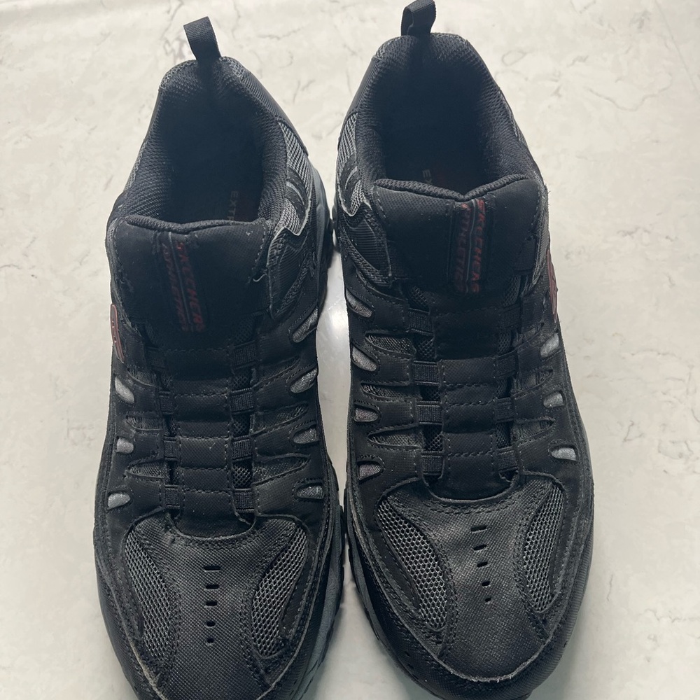Brand new black men’s Skechers shoes size 11.
